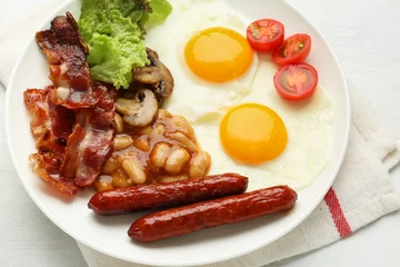 Fotobehang Delicious breakfast with sunny side up eggs on white table, closeup © New Africa