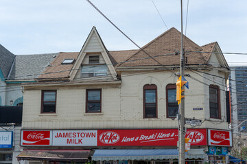 Obraz premium exterior building facade and sign of Jamestown Milk, a convenience store, located at 592 Parliament Street in Toronto, Canada
