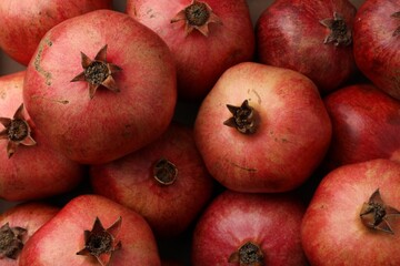 Fresh ripe pomegranates as background, top view