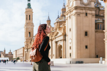 Fototapeta premium Traveler observing the Basilica del Pilar in the city center of Zaragoza, Spain