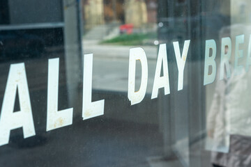 old vinyl lettering on diner window: reads in part all day breakfast