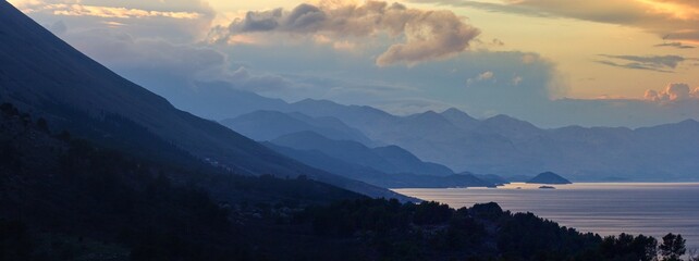 Panoramic view of the coast mountains at Skadar Lake from Rozafa castle during dusk, Shkodër,...