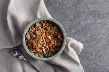 Fotobehang Tasty granola in bowl, spoon and napkin on gray textured table, flat lay. Space for text © New Africa