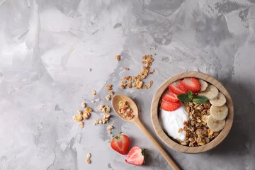 Fotobehang Tasty granola served on gray textured table, flat lay. Space for text © New Africa