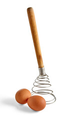 Two beige chicken eggs and a spiral metal whisk are isolated on a white background