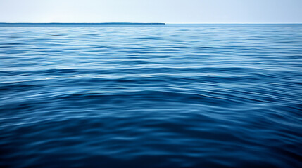 The ocean is calm and blue, with no visible waves