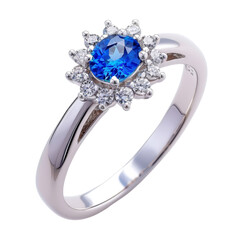Elegant Sapphire Ring with Diamond Halo on a Reflective Surface, Representing Luxury and Sophistication.