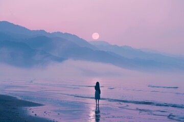 A woman stands on the beach, gazing at the moon during sunset