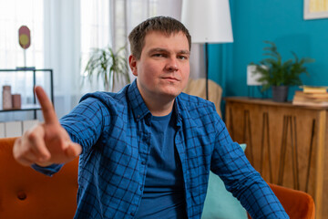 Displeased upset man reacting to unpleasant awful idea, dissatisfied with bad quality, wave hand...
