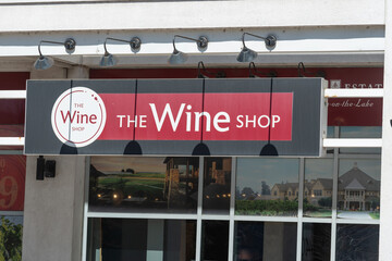 Fototapeta premium exterior building and sign of The Wine Shop located at 228 Queens Quay West in Toronto, Canada