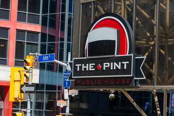 Fototapeta premium exterior sign of The Pint Public House located at 277 Front Street West in Toronto, Canada