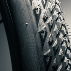 Close-up macro view of a new bicycle tire showing the detail of the rubber tread

