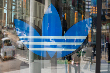 Fototapeta premium close-up of logo sign at adidas Originals Store, a sportswear store, located at The Well shopping center, 486 Front Street West in Toronto, Canada
