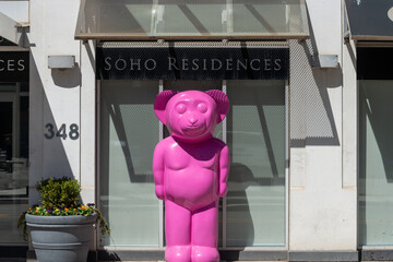 Fototapeta premium exterior pink cartoon character outside SoHo Residences (Apartment Hotels) located at 348 Wellington Street West in Toronto, Canada