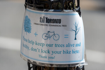 Fototapeta premium faded city of Toronto notice posted on a tree