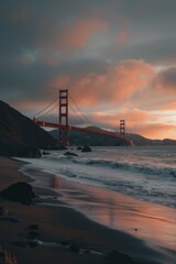 Golden Gate Bridge seen from beach at sunset with red sky
