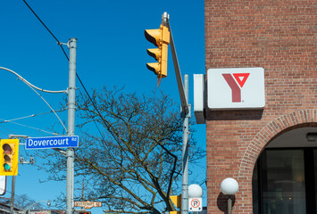 Fototapeta premium exterior building and sign of West End YMCA, a fitness center, located at 931 College Street in Toronto, Canada
