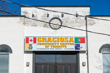 Fototapeta premium exterior building facade and light box sign of Graciosa Community Centre Of Toronto located at 279 Dovercourt Road