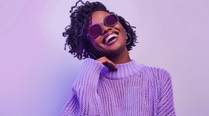 Happy African American Woman in Purple Sweater and Sunglasses Smiling, Standing on Purple Background