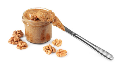 Delicious nut butter in jar, knife and walnuts isolated on white