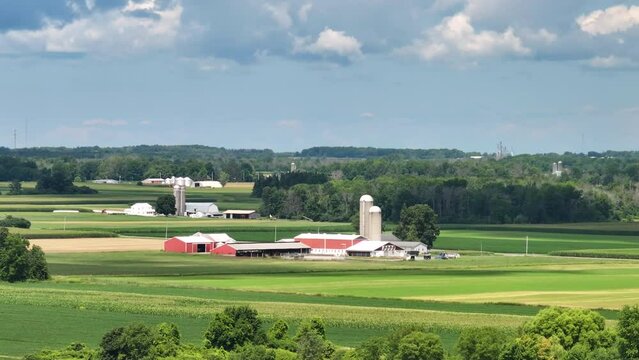 American rural farm with silos in Midwestern USA. Agricultural landscape in United States