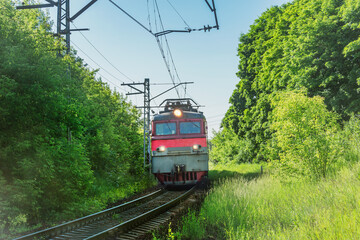 Freight train approaches to the station at summer day. - 783154714