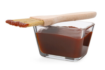 Marinade in bowl and basting brush isolated on white