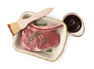 Raw meat, rosemary and brush with marinade isolated on white, top view