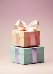 Obraz premium Pastel gift boxes with ribbon on pink background, packaging yellow wrapped single object birthday present
