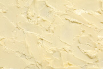 Texture of fresh natural butter as background, top view