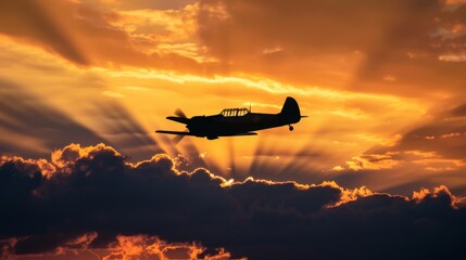 A small motor plane is flying through a cloudy sky, with its silhouette visible against the...