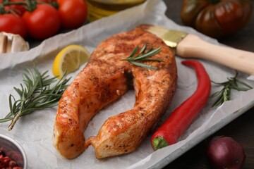 Fresh marinade, fish, brush and other products on table, closeup
