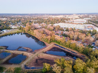 Aerial landscape of forest and pond at sunset in Augusta Georgia