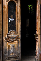 Open wooden antique door. Entrance to the house.