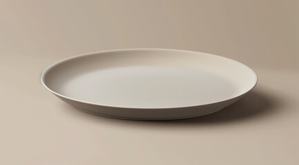 A minimal round plate in a light beige color placed on a table.