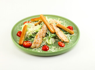 Chicken Salad. Chicken Caesar Salad. Caesar Salad with grilled chicken and croutons. Grilled chicken breast and fresh green salad isolated on white