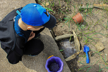child playing with sand