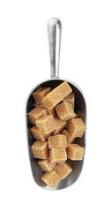 Brown sugar cubes in metal scoop isolated on white, top view