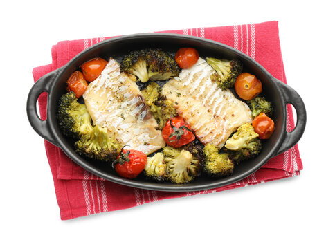 Tasty cod cooked with vegetables in baking tray isolated on white, top view