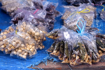 Plastic bags of dried spices and herbs like Aleurites moluccanus or candlenut, laurel leaves, pepper and star anise that are use as traditional alternative medicines in North Sumatra, Indonesia