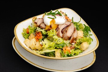 Delicious Grilled Chicken Salad with Lettuce, Tomatoes, Croutons, and Poached Egg