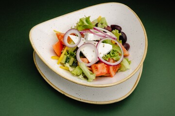 Fresh Greek Salad with tomatoes, cucumber, peppers, red onion, olives, and feta cheese