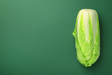 Fresh ripe Chinese cabbage on green background, top view. Space for text - obrazy, fototapety, plakaty