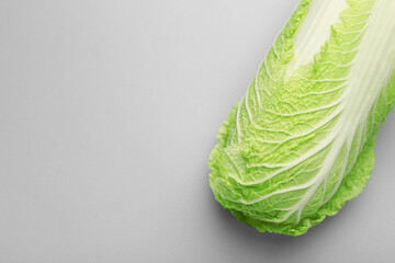 Fresh ripe Chinese cabbage on grey background, top view. Space for text - obrazy, fototapety, plakaty