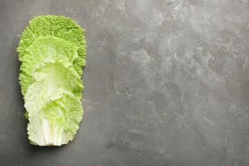 Fresh Chinese cabbage leaves on gray textured table, top view. Space for text - obrazy, fototapety, plakaty