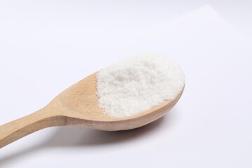 Natural salt in wooden spoon isolated on white