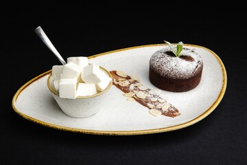 Decadent dark chocolate lava cake with a scoop of vanilla ice cream