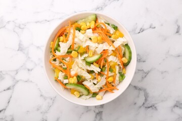 Tasty salad with Chinese cabbage, carrot, corn and cucumber in bowl on white marble table, top view