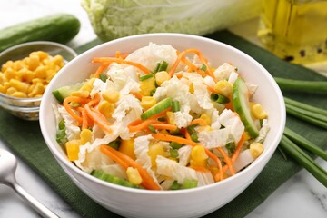 Tasty salad with Chinese cabbage, carrot, corn and cucumber in bowl on table, closeup