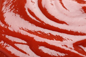 Tasty ketchup as background, closeup. Tomato sauce